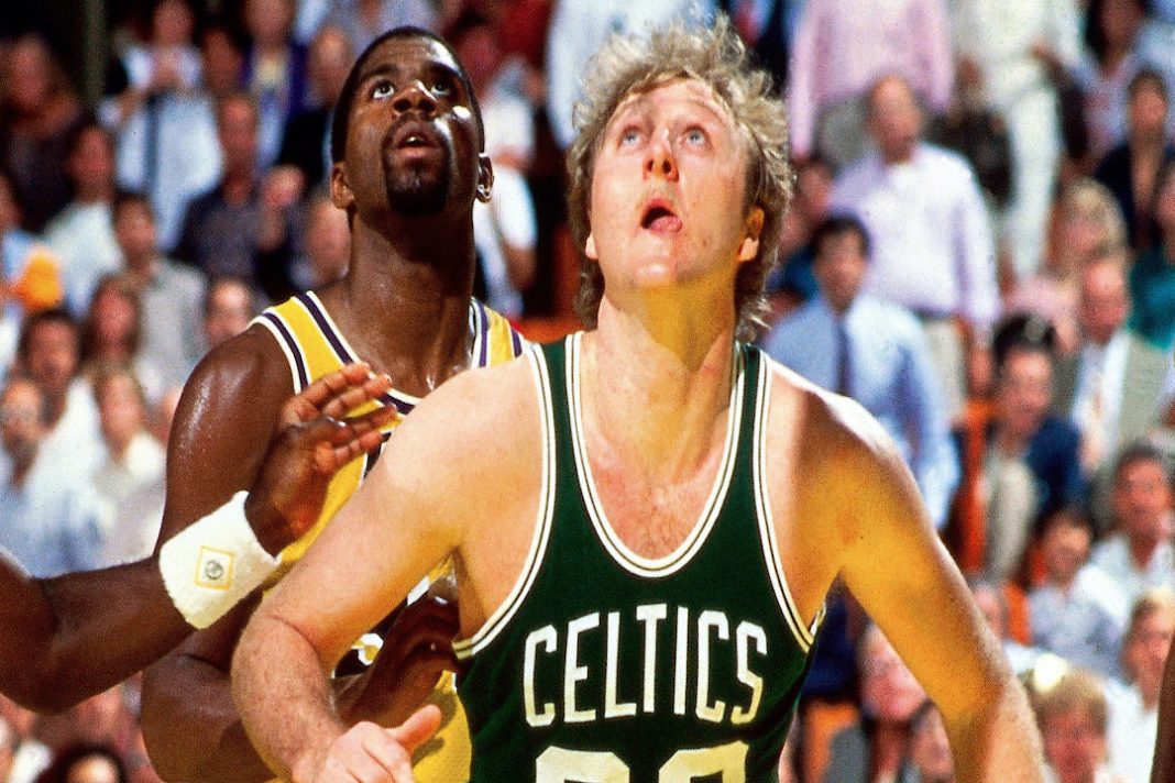 Larry Bird defending Magic Johnson